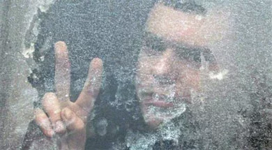 Fota Reuters zroblena 20 śniežnia kala turmy na Akreścina. Zatrymanych viazuć na sud u aŭtobusie.